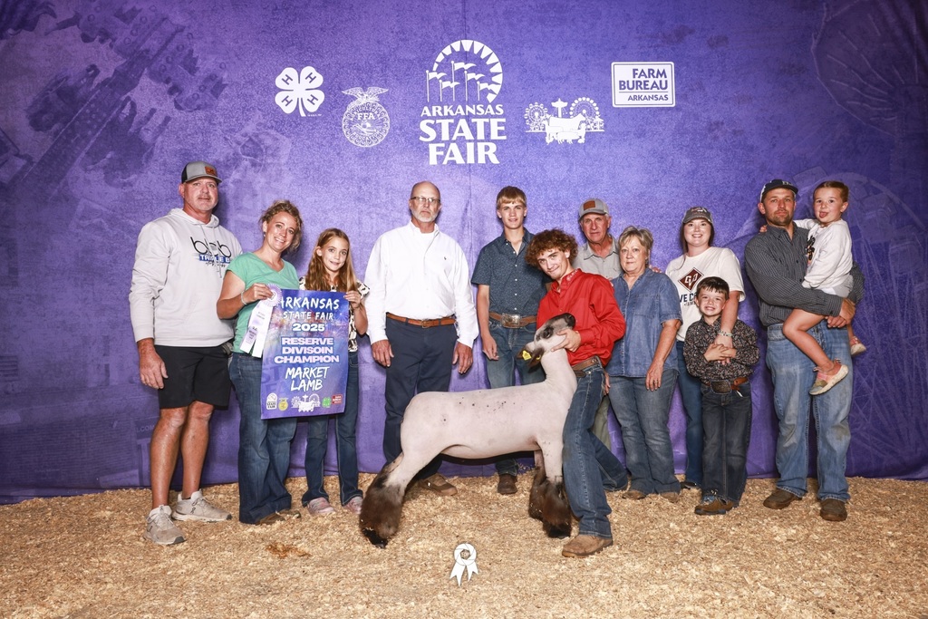 student posing with goat