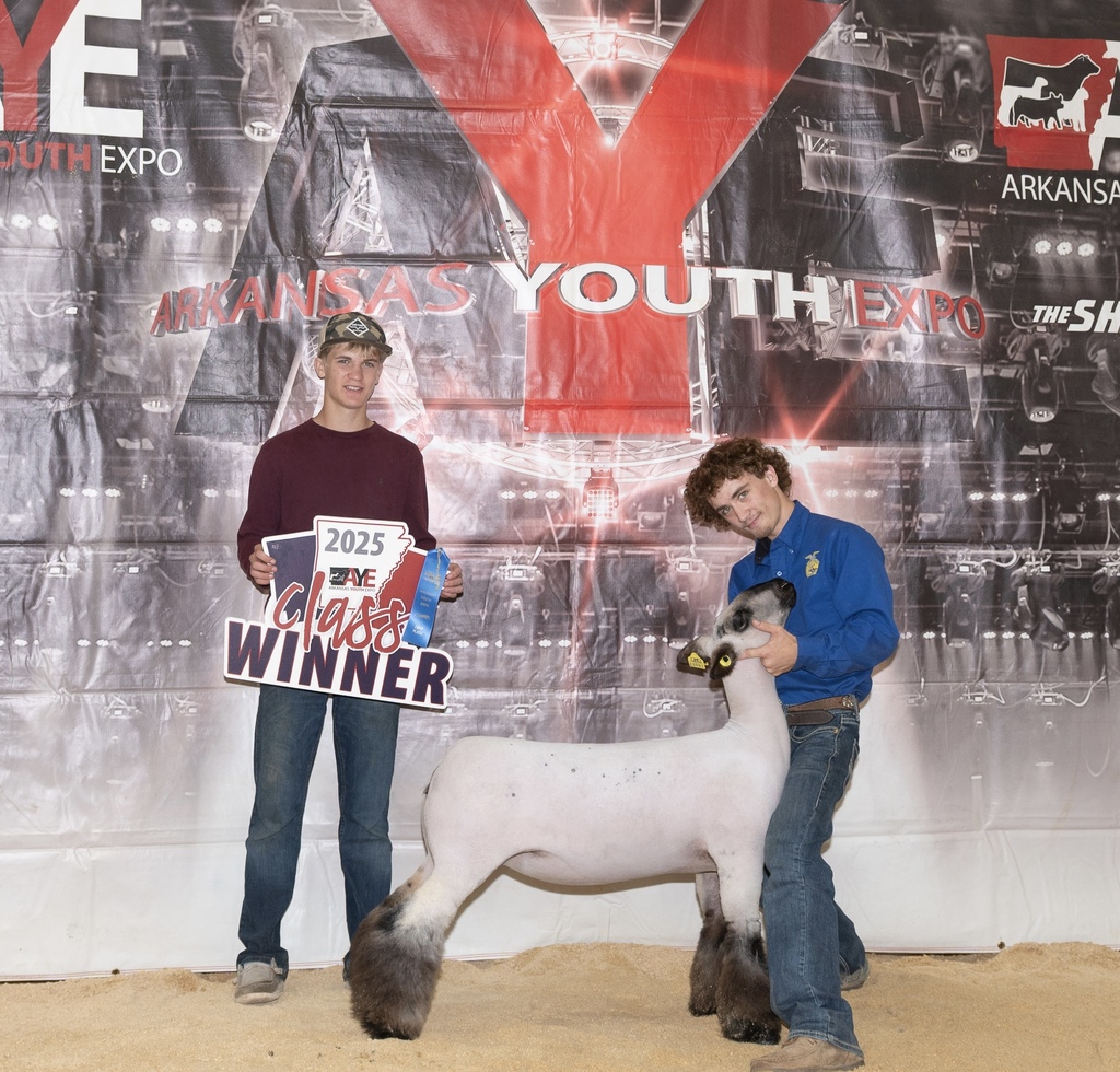 student posing with goat