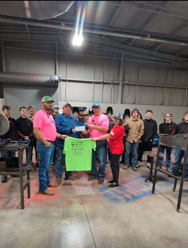 students posing with check
