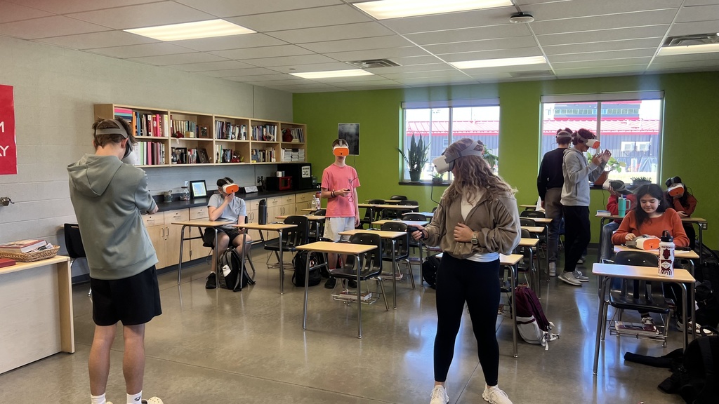 students standing around using VR