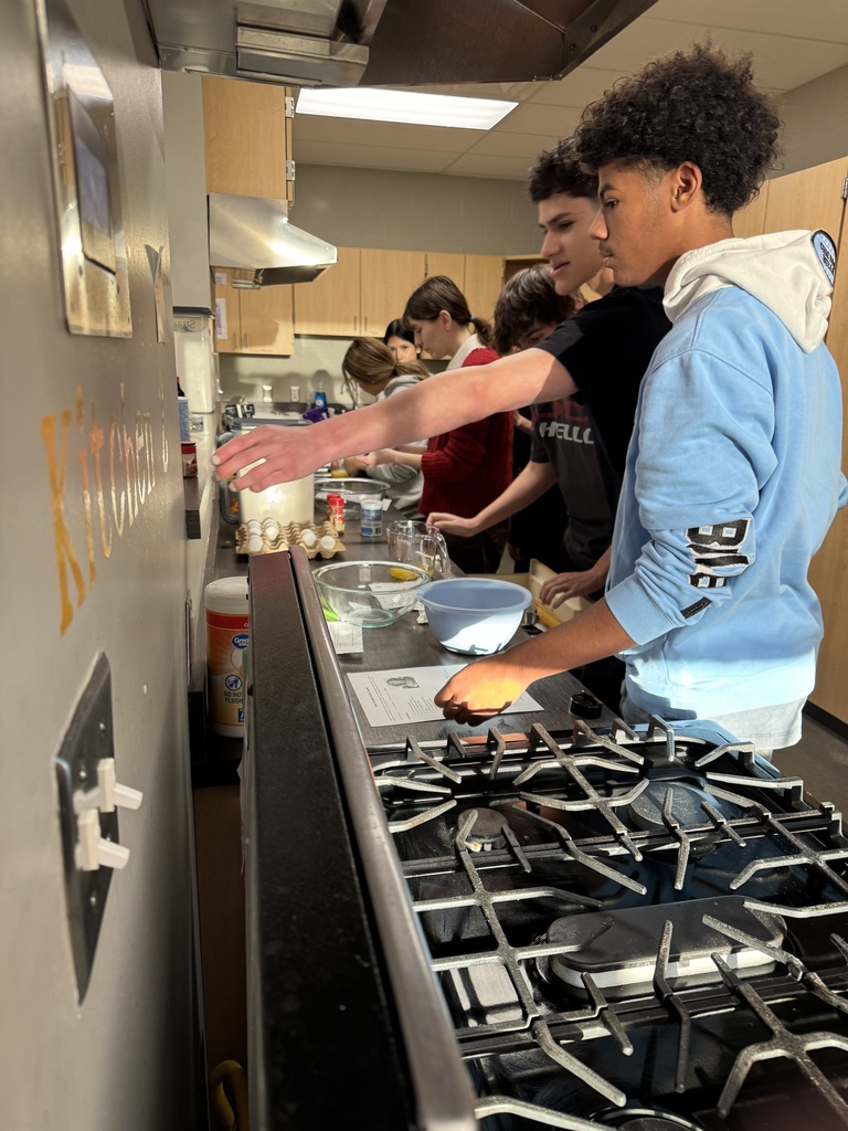 students cooking in kitchen at school
