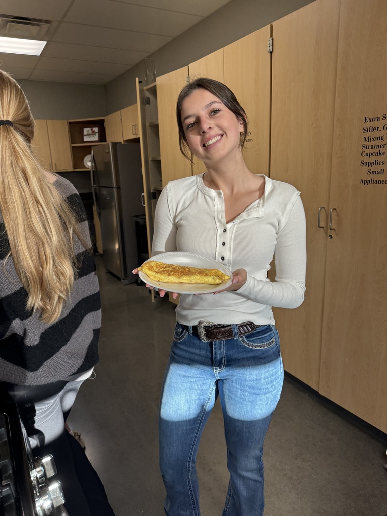students cooking in kitchen at school