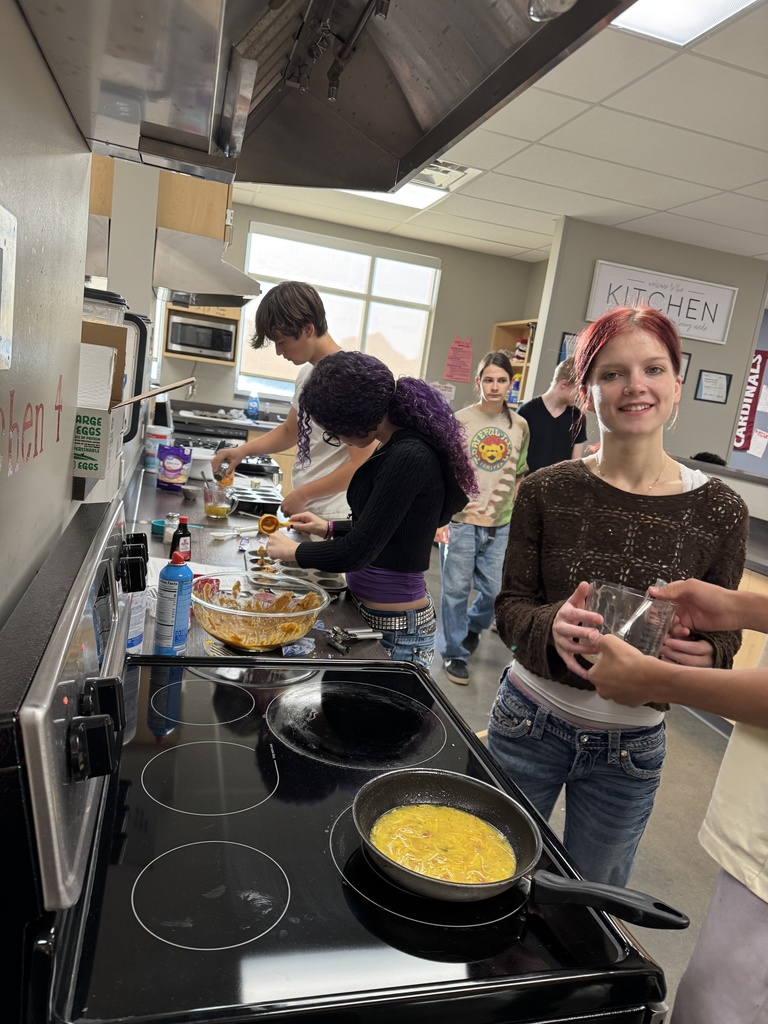 students cooking in kitchen at school