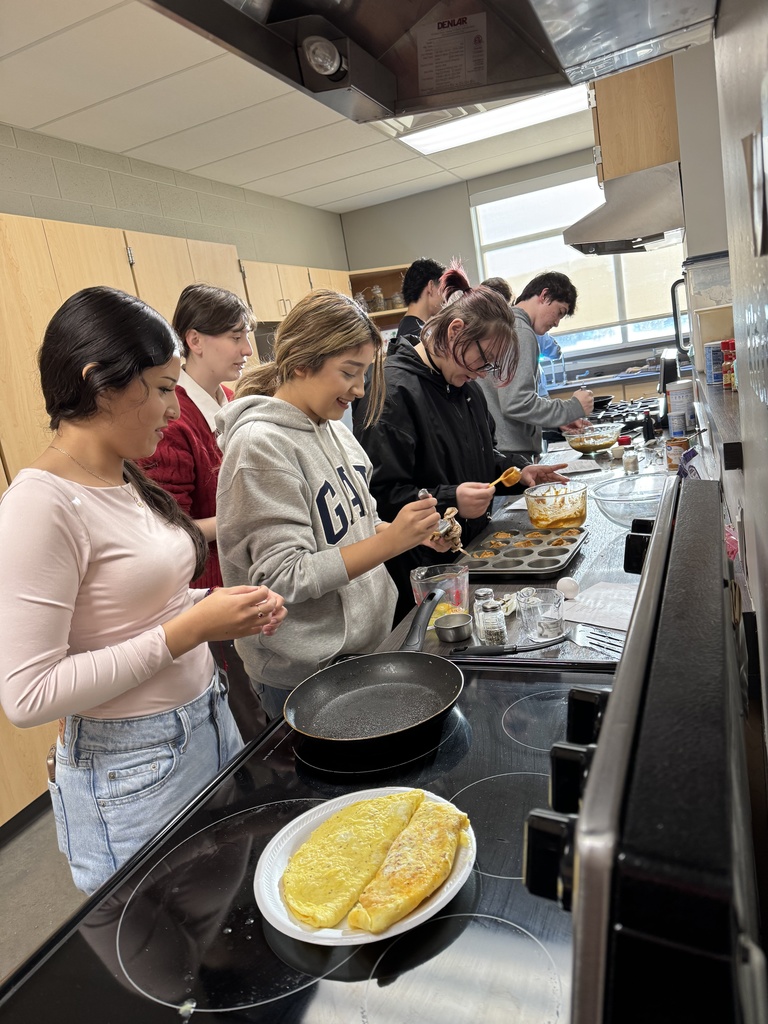 students cooking in kitchen at school