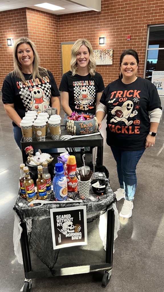 teachers posing with cart