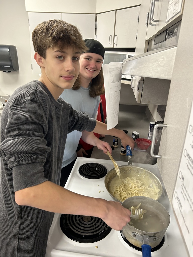 Students in FAC cooking pasta