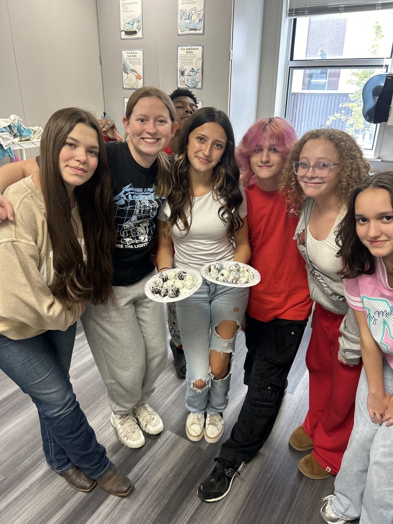 Students in FAC holding Oreo balls