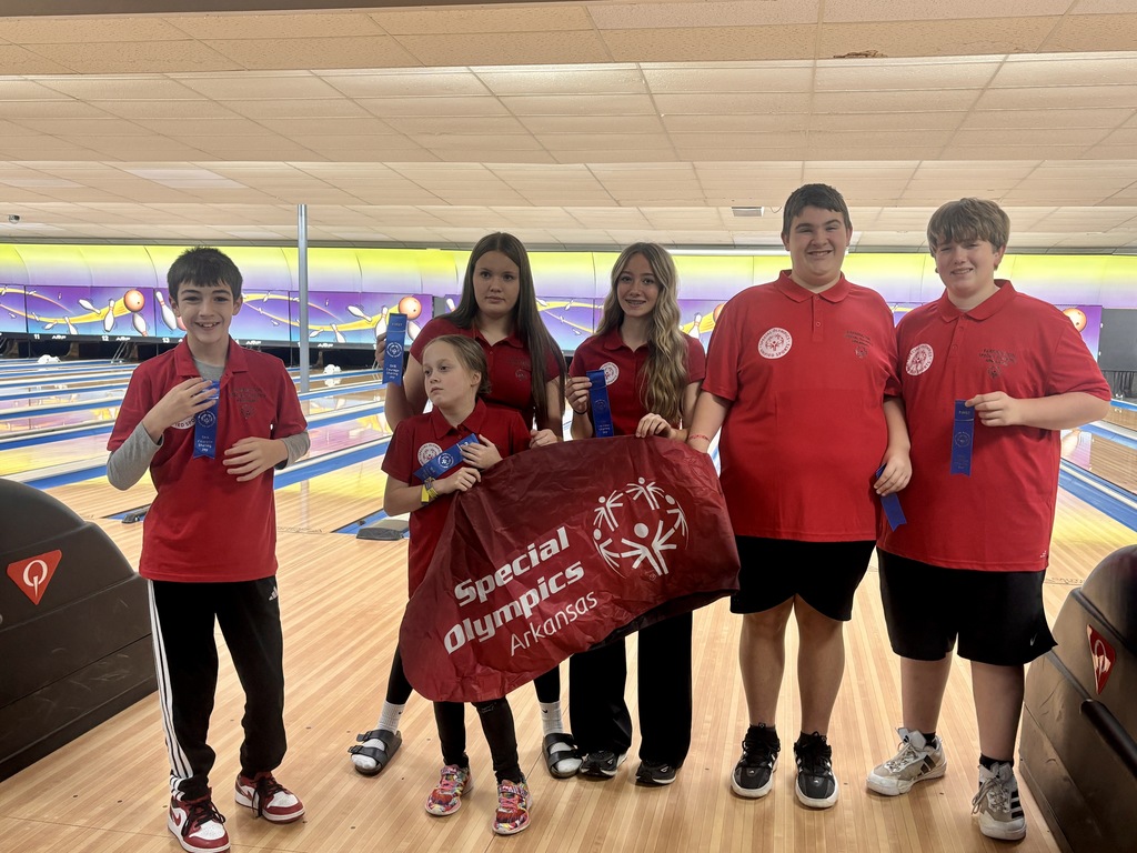 students posing with banner