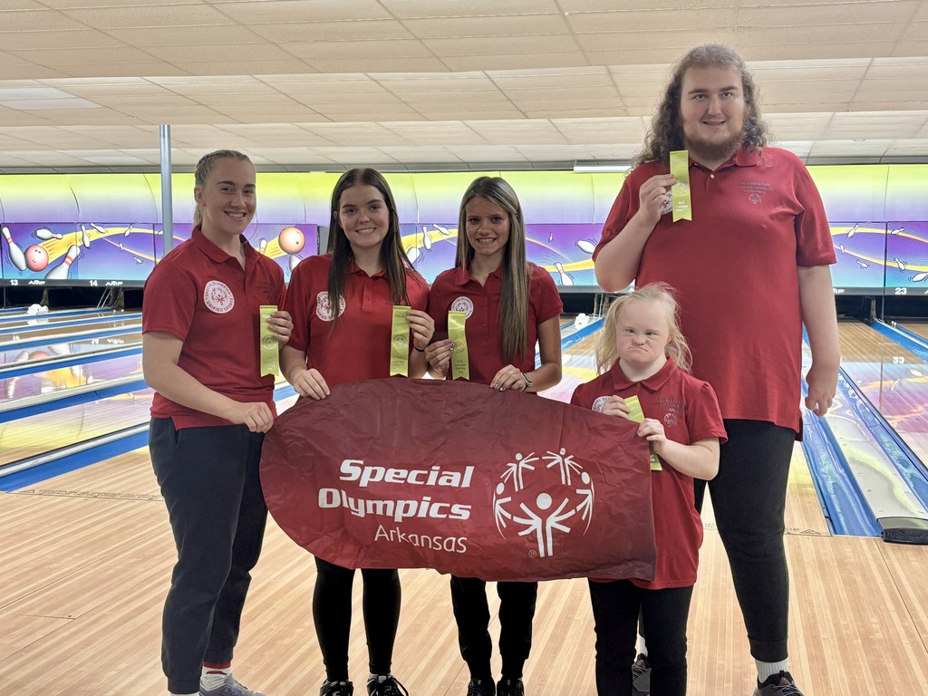 students posing with banner