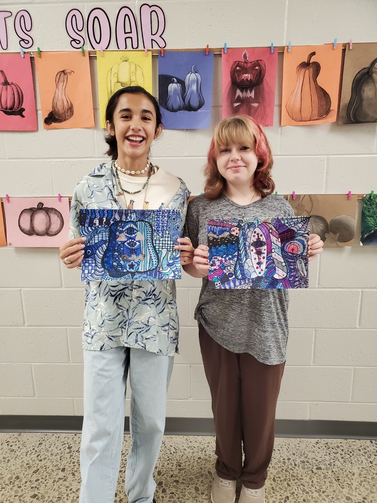 Student shows off her pumpkin art