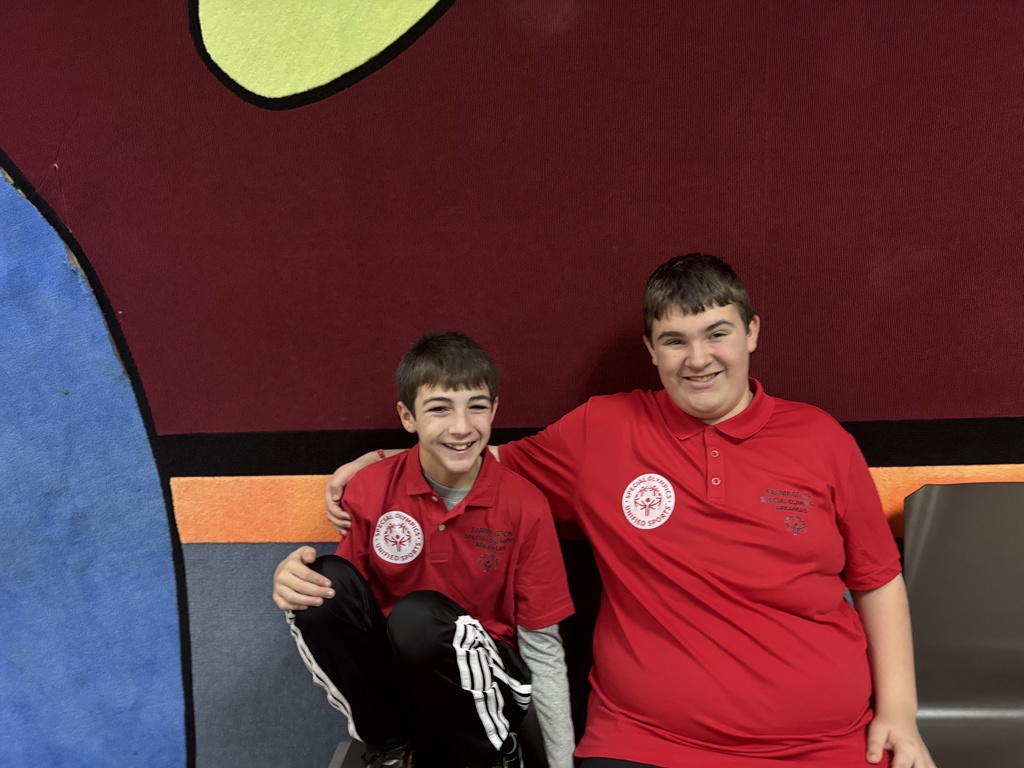 Students smiling at the bowling alley