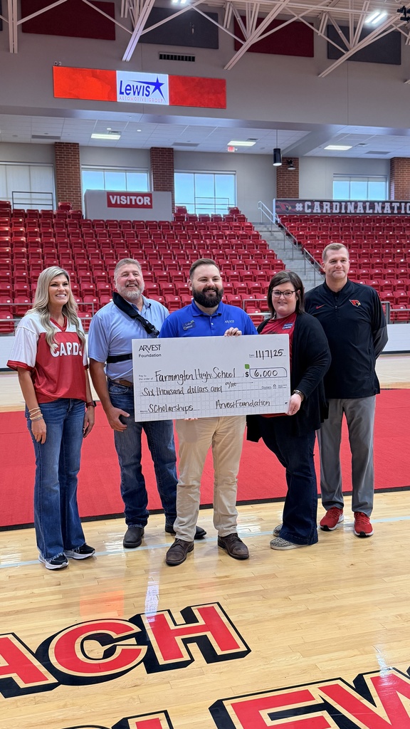 personnel posing with giant check