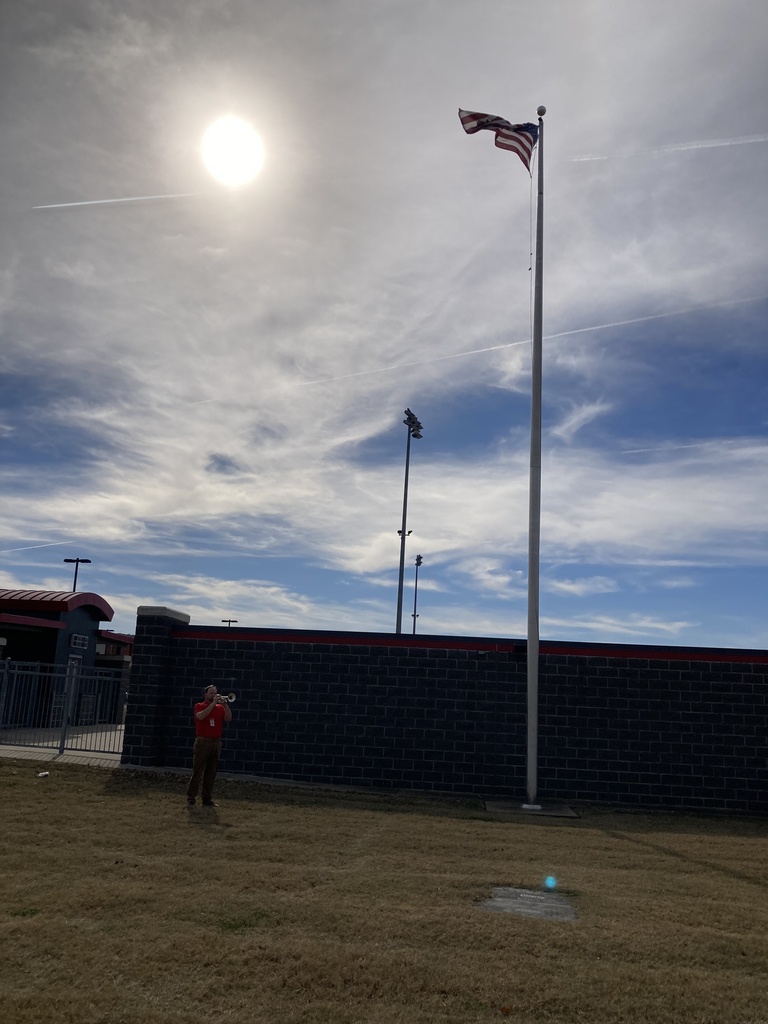 teacher playing trumpet
