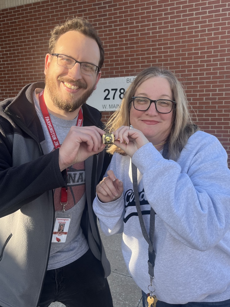 Mr. Silva and Mrs. Sundquist holding a prize