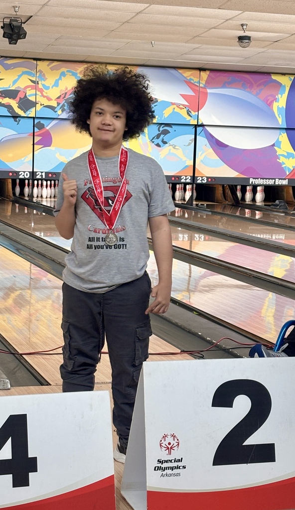 students posing with medals