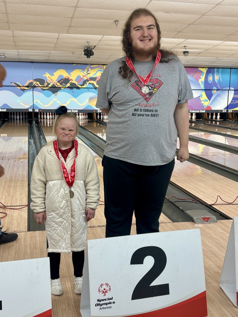 students posing with medals