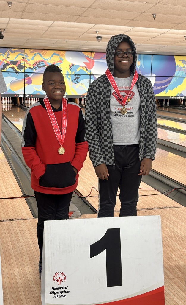 students posing with medals
