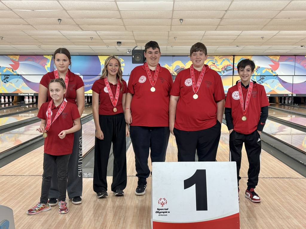 students posing with medals