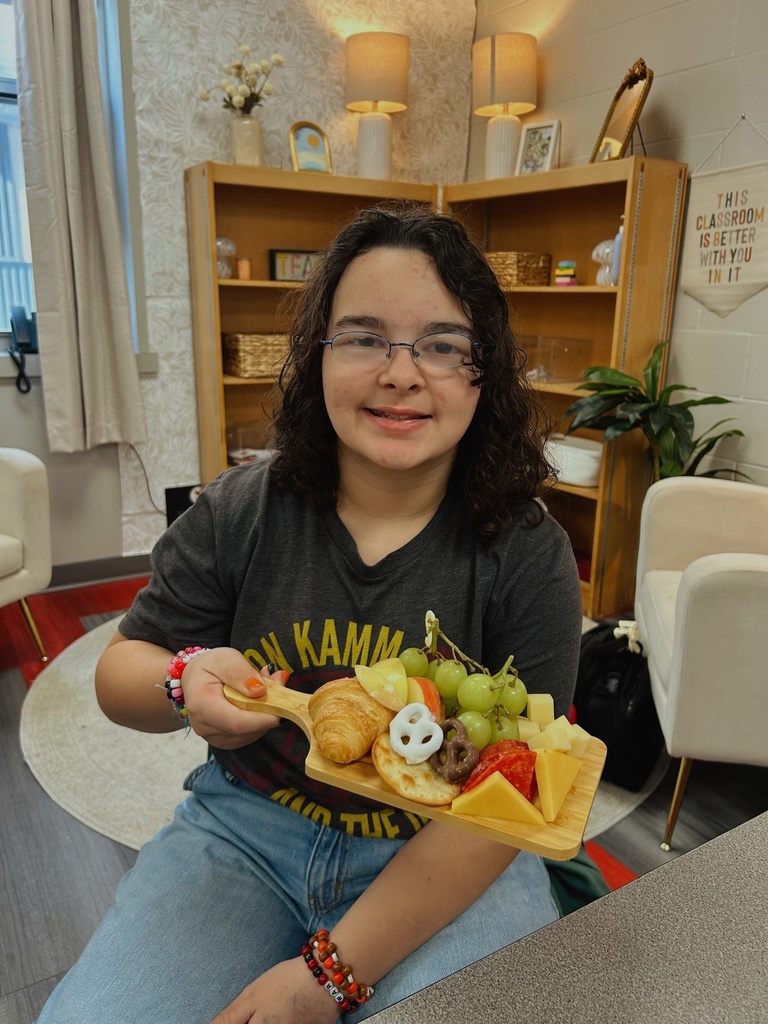 Student with charcuterie board