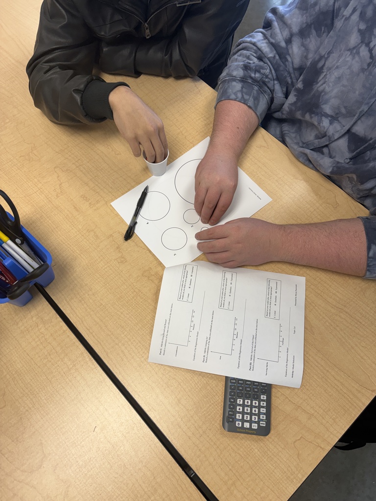 students working with m&ms and paper