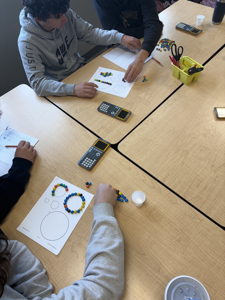 students working with m&ms and paper