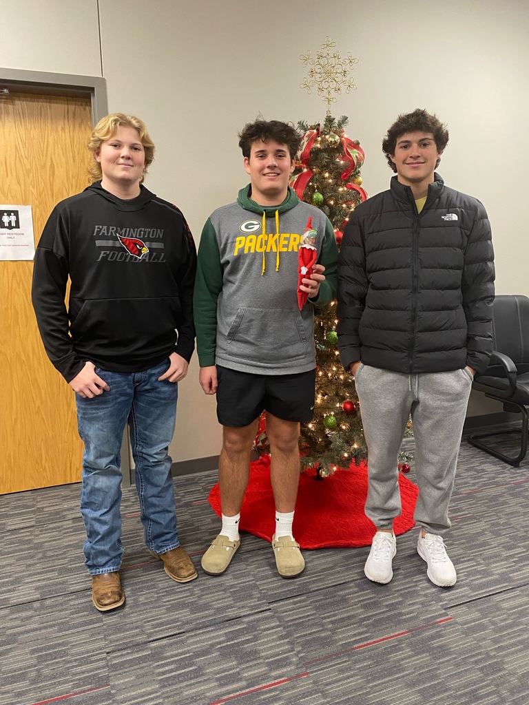 students posing at hiding spot