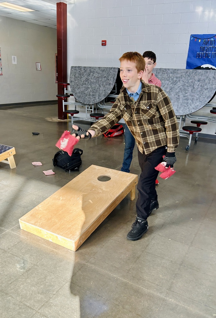 Student playing Baggo at Reward Day