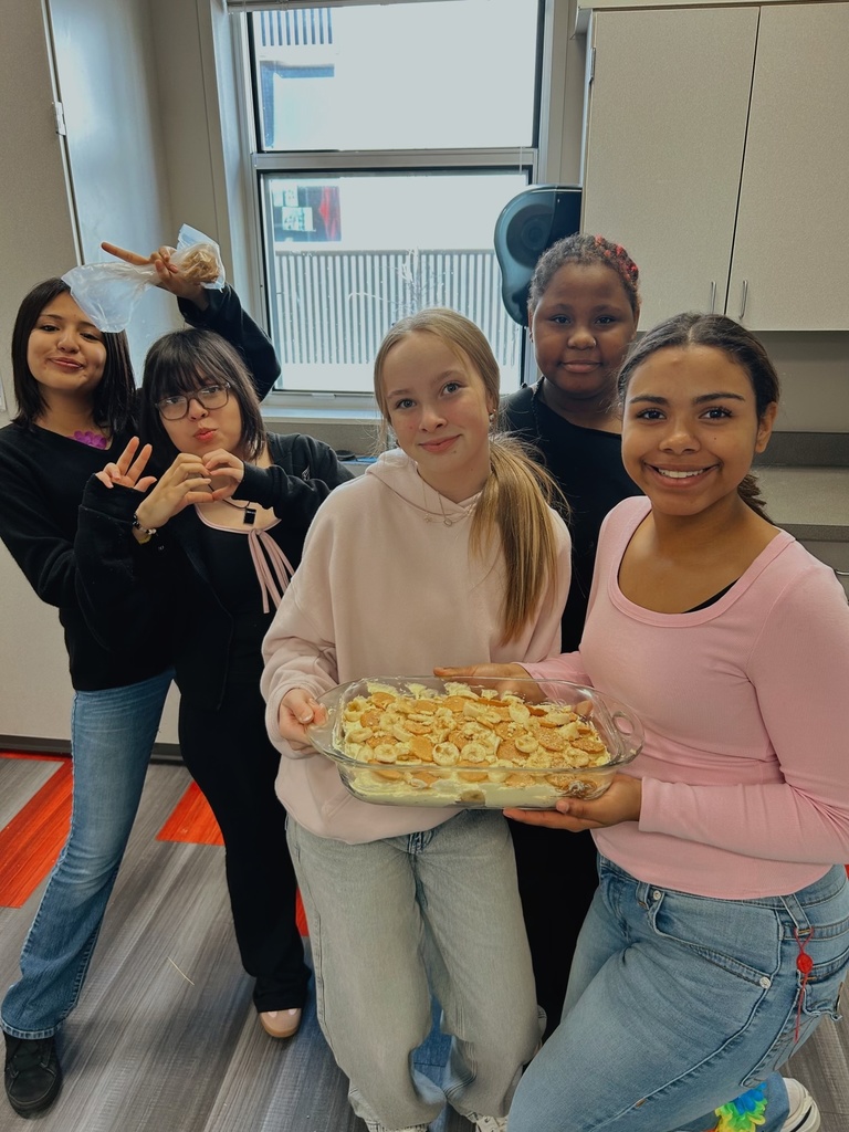 Students holding a dessert they made in FACS