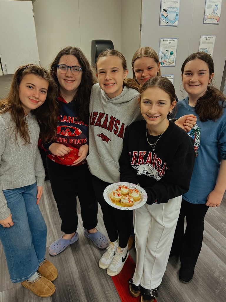 Students holding a dessert they made in FACS