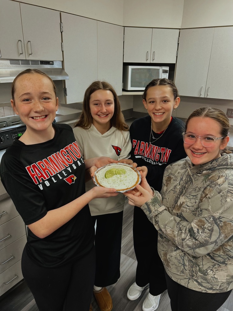 Students holding a dessert they made in FACS