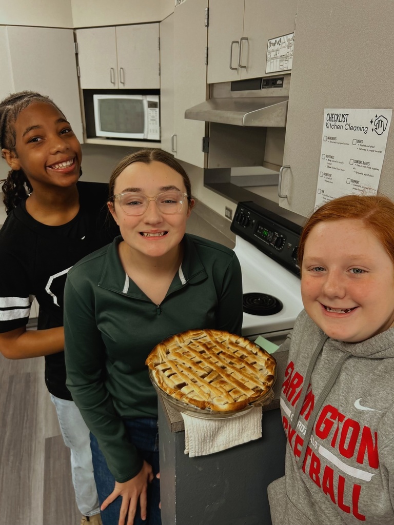 Students holding a dessert they made in FACS