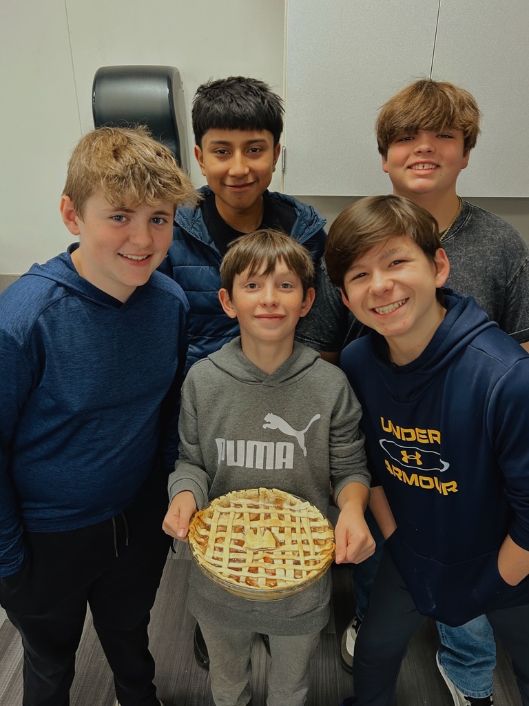 Students holding a dessert they made in FACS