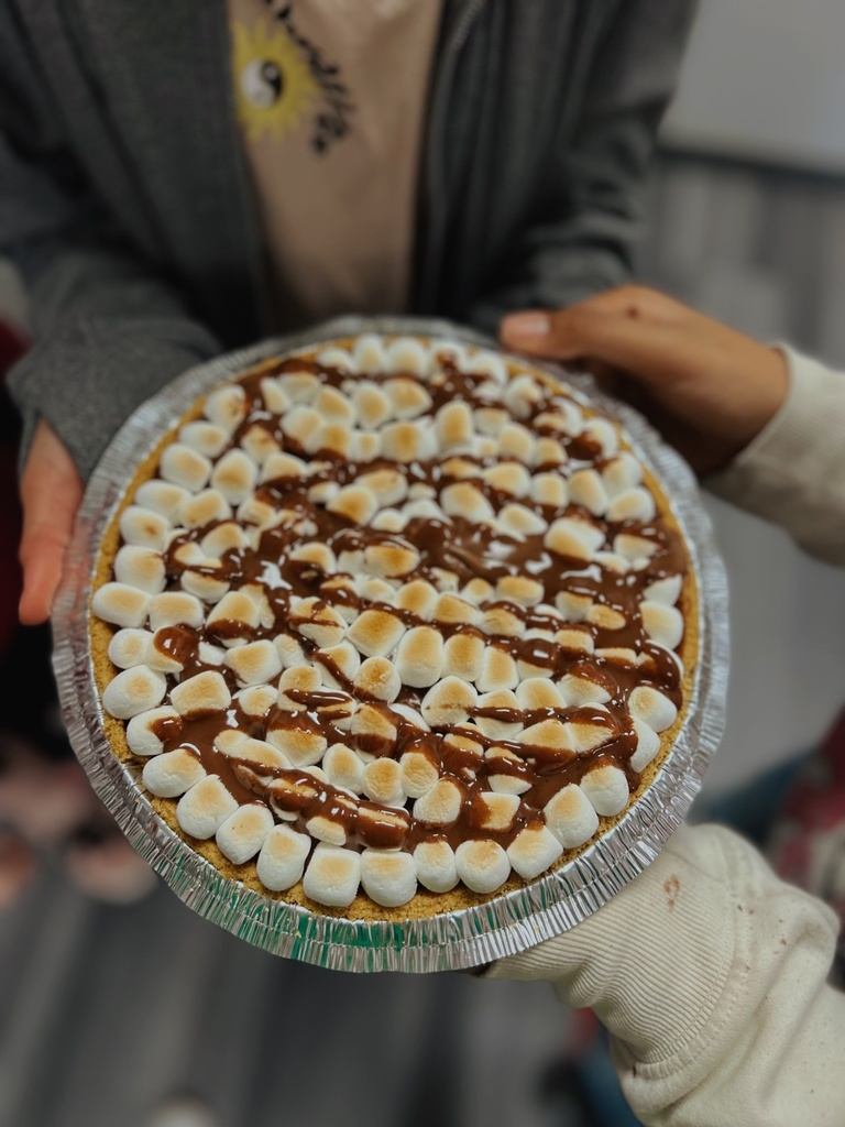 Students holding a dessert they made in FACS
