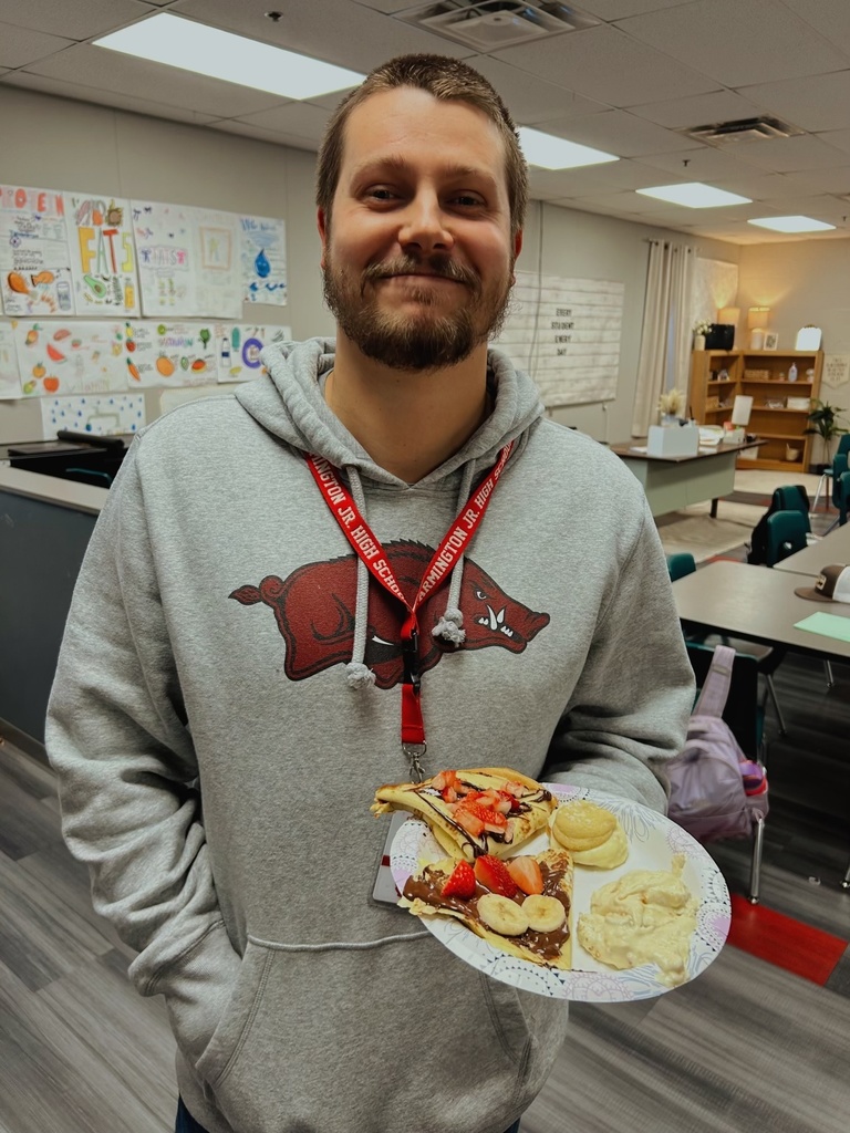 Teacher holding desserts from FACS