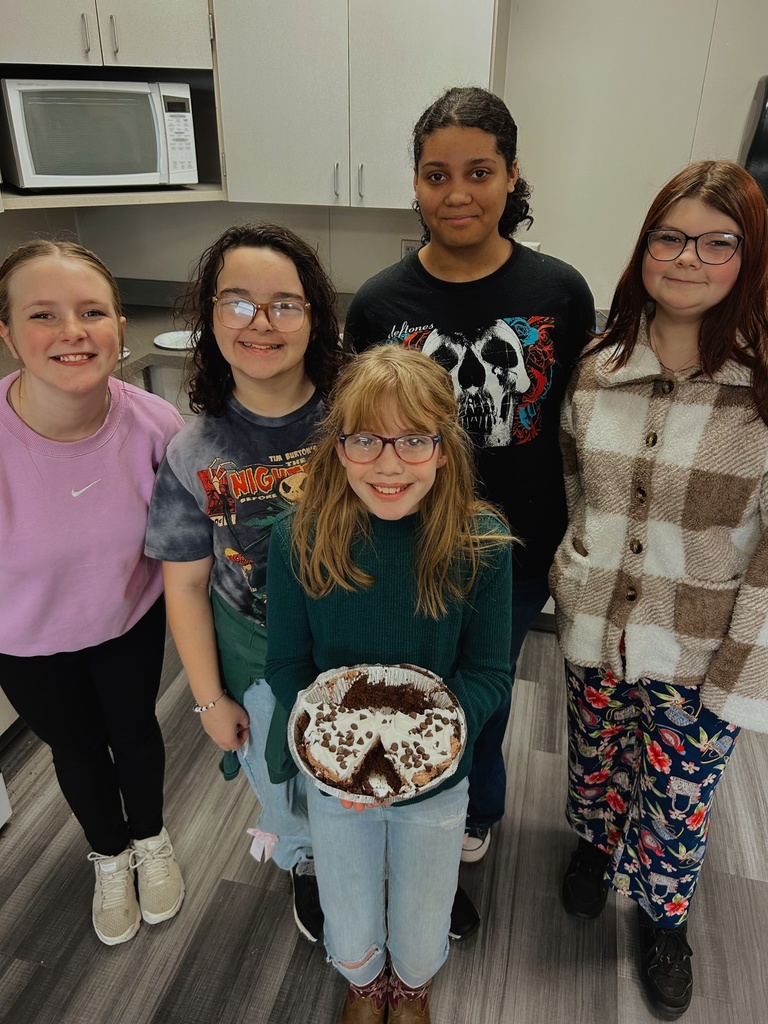 Students holding a dessert they made in FACS