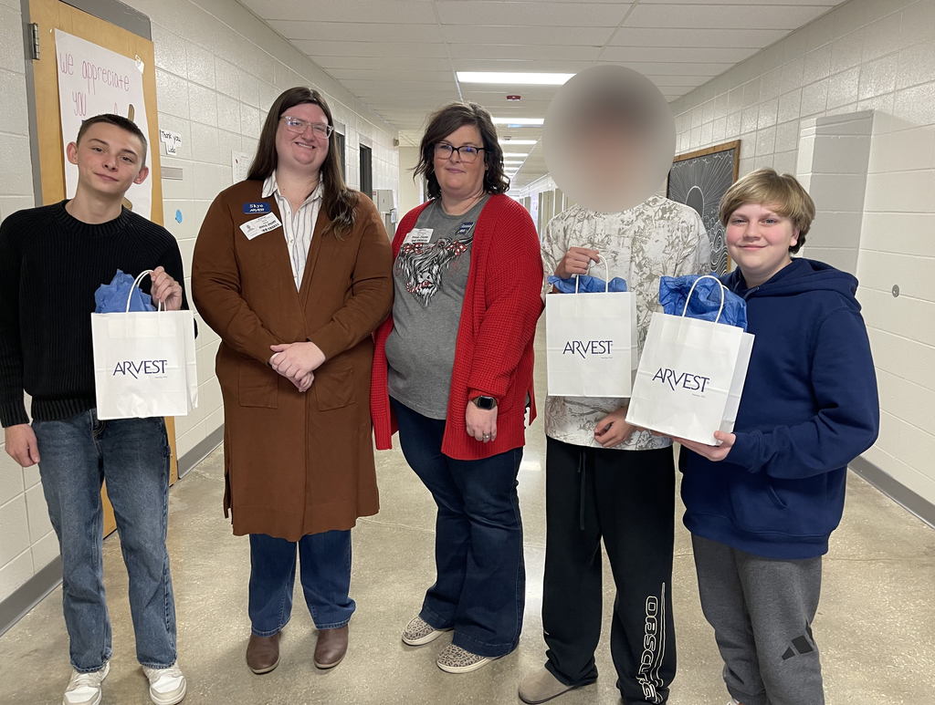 Guest speakers from Arvest pose for photo with students