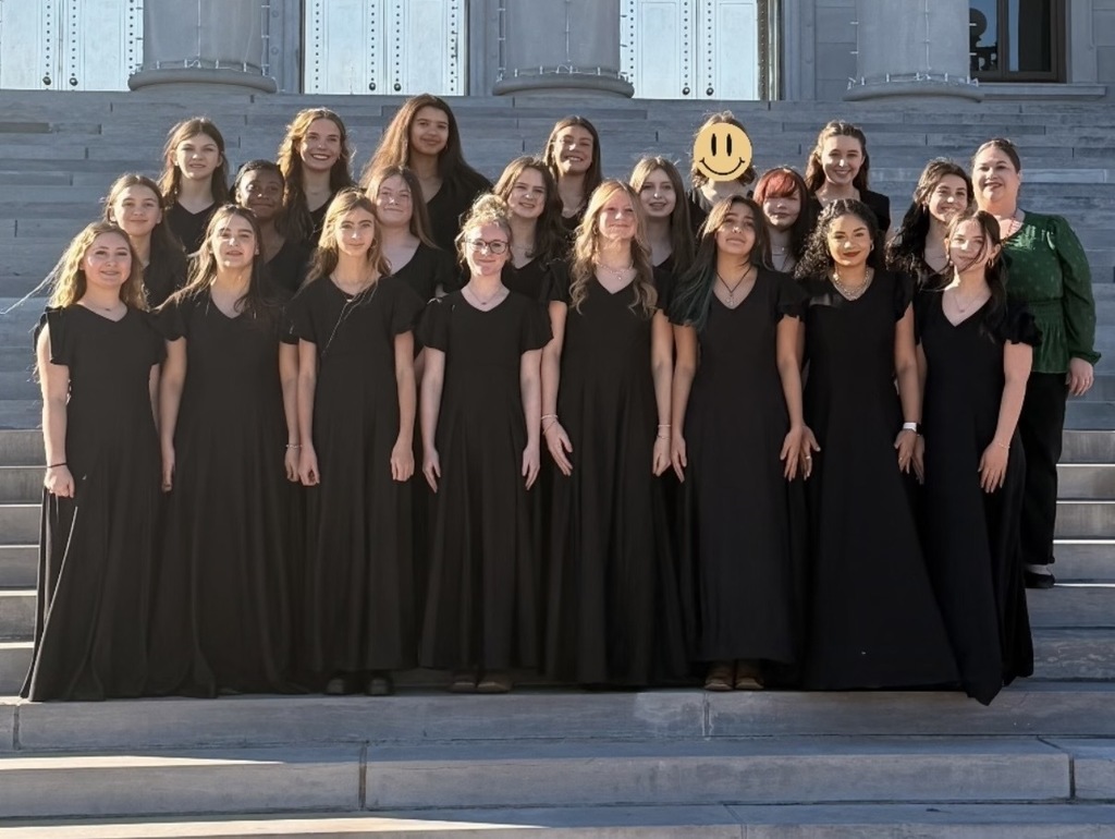 Choir posing for photo on steps