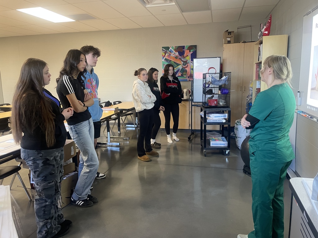 students listening to presenter 