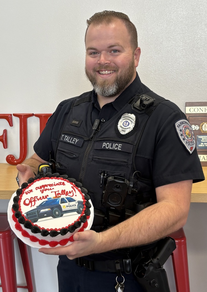 Officer Talley, holding cake