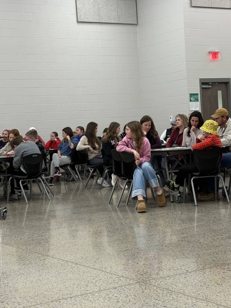 families sitting at tables at Parent Night