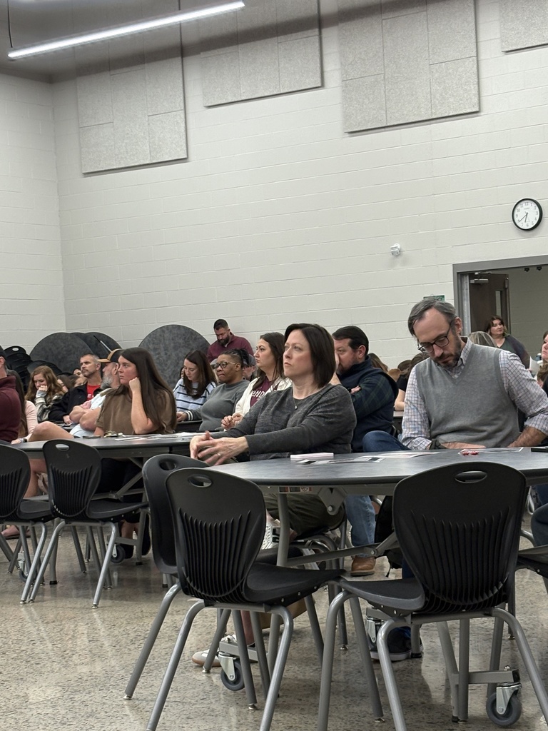 families sitting at tables at Parent Night