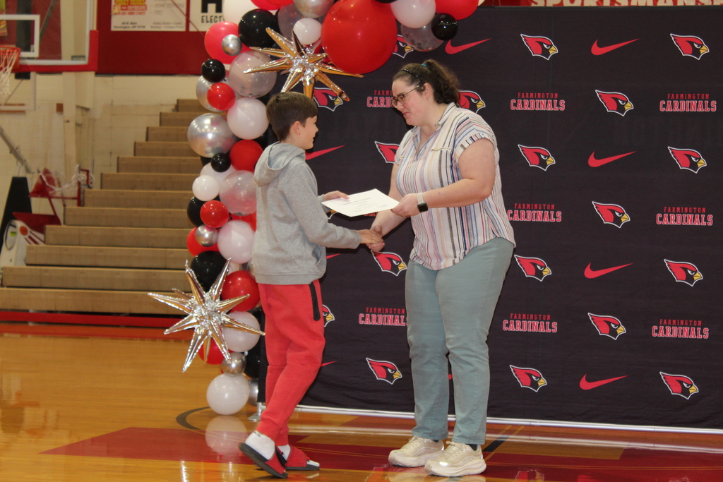 Student receiving an award at the Fall Awards assembly