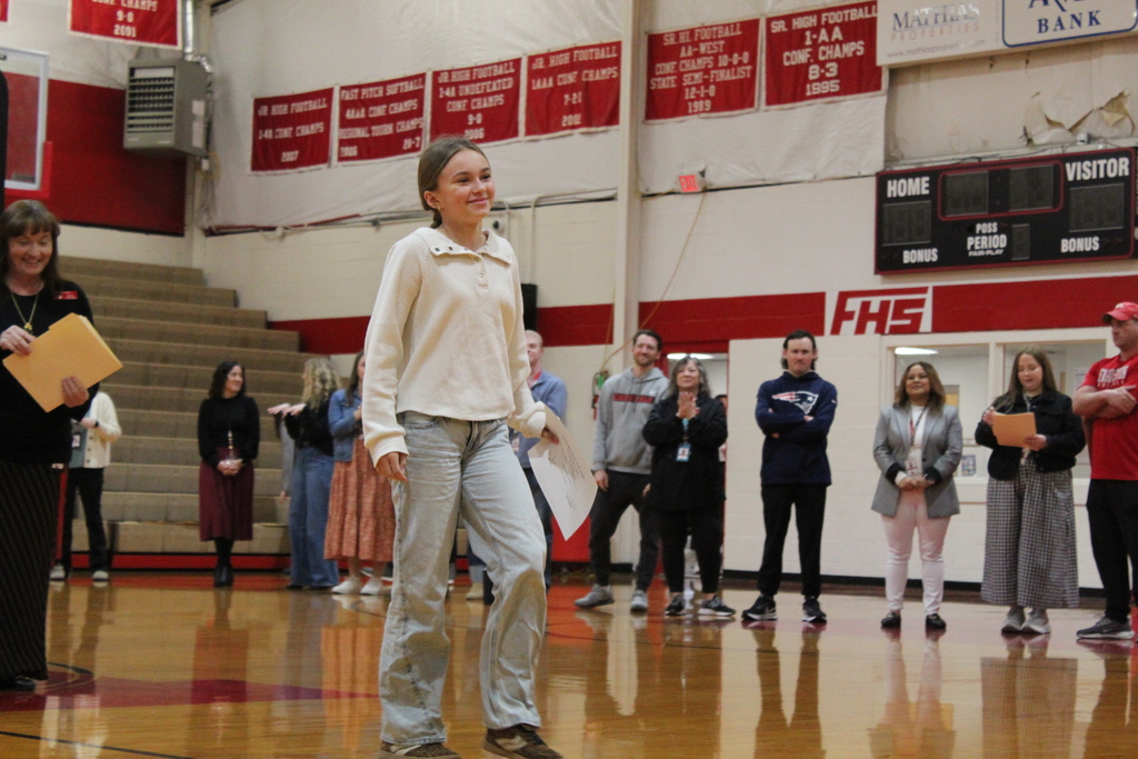 Student receiving an award at the Fall Awards assembly