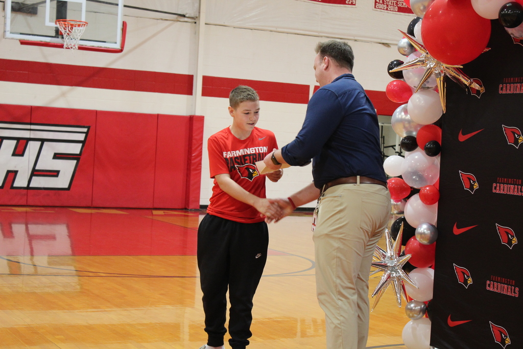 Student receiving an award at the Fall Awards assembly