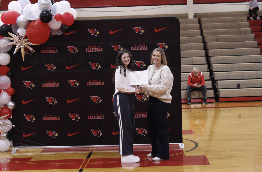 Student receiving an award at the Fall Awards assembly