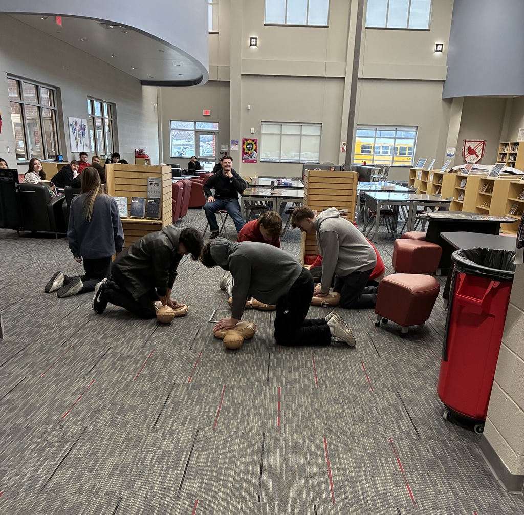 students performing CPR