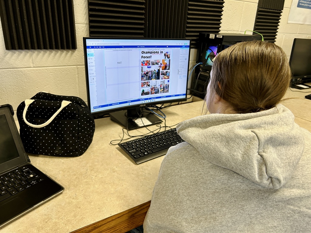 Yearbook students working on the computer