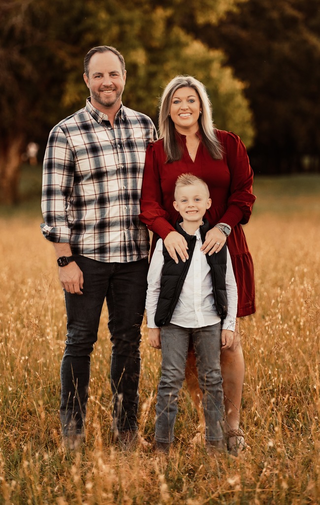 picture of counselor and her family in field