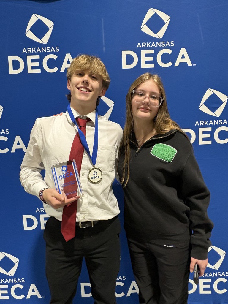 students posing with awards