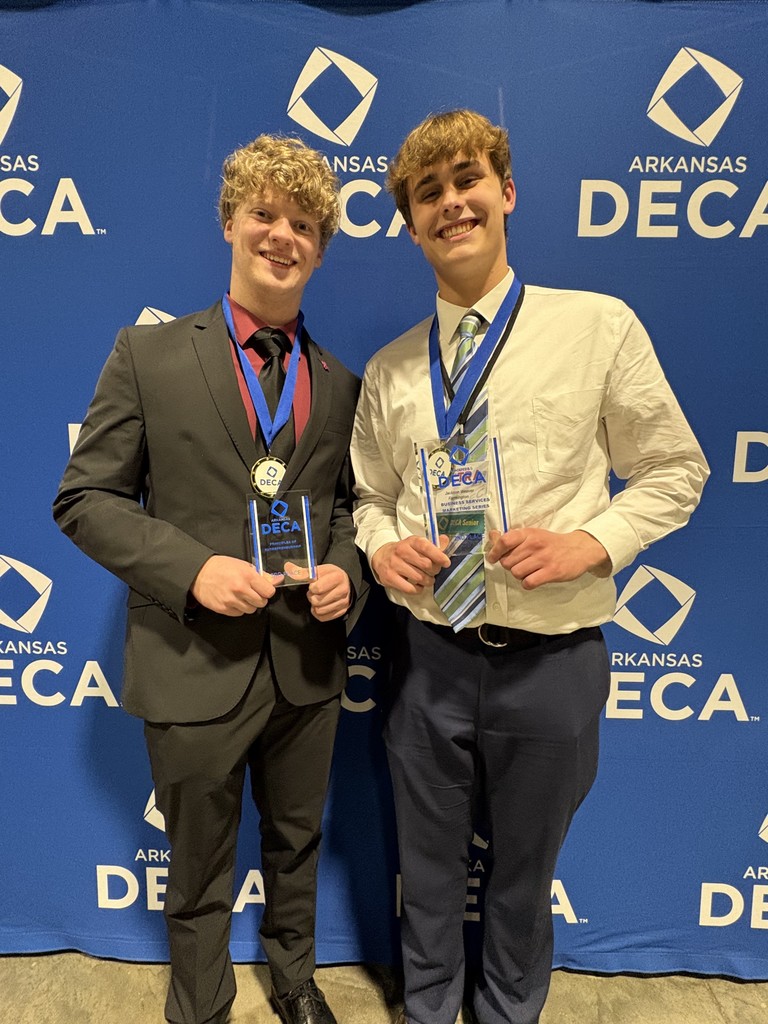 students posing with awards